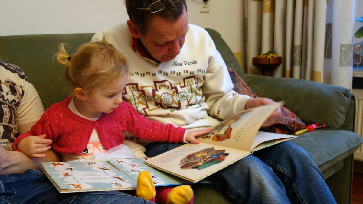 Read for reading language development book child carefully girl grandchild
